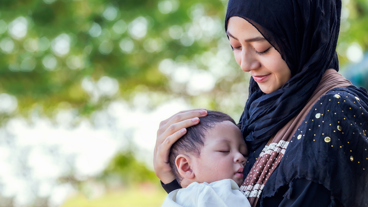 woman carrying child